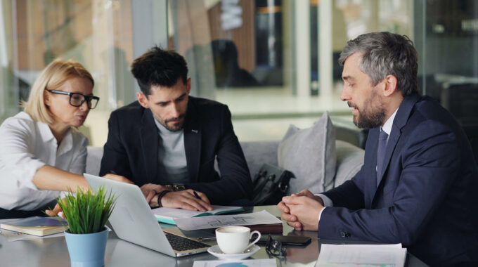Business owner reviewing liability insurance coverage to protect the company against third-party claims and financial risks.